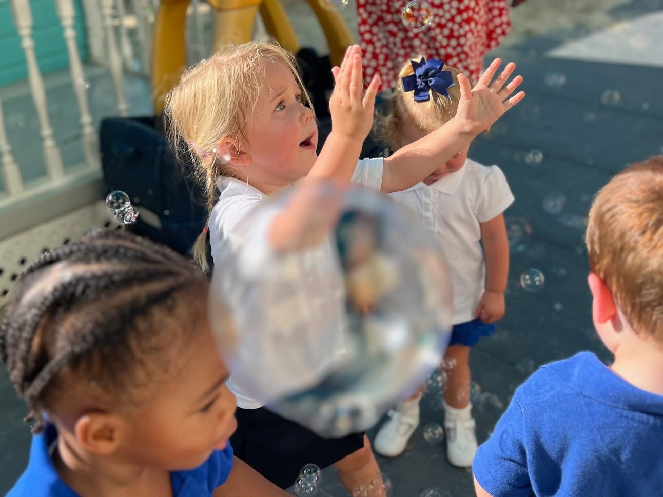 Young Antilles students playing with bubbles